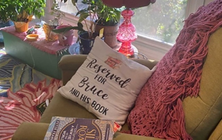 Re-learning to read comfy chair with book and pillow